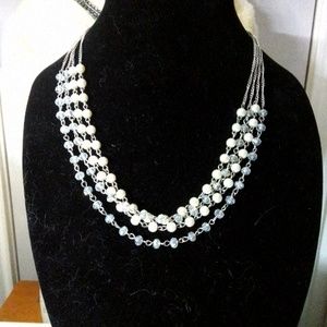 Beautiful clear beaded faux Pearl necklace.  Necklace is 10 inches long with ext